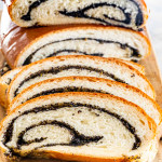 front shot of sliced poppy seed roll with the beautiful swirls exposed