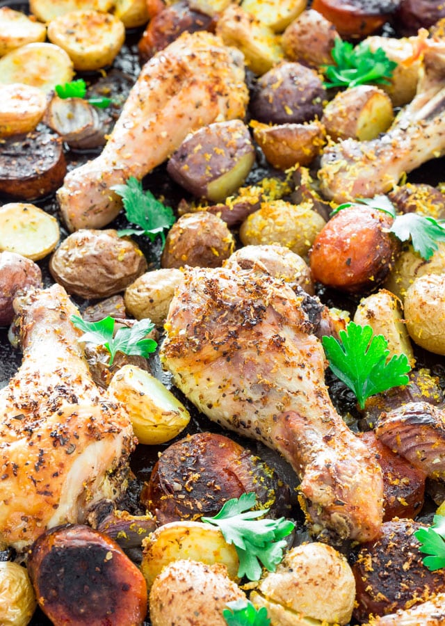 Spanish Chicken with Chorizo and Potatoes on a baking sheet fresh out of the oven