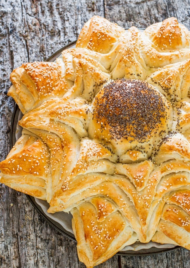 Sunflower Bread - a delicious bread that's shaped to look like a sunflower, sprinkled with poppy seeds and sesame seeds.