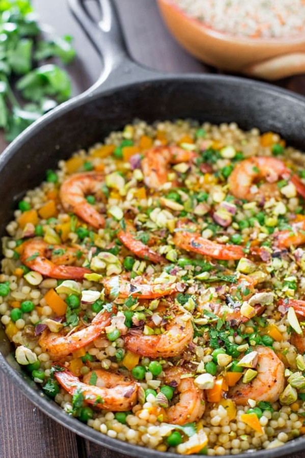 couscous with shrimp and peas in a pot