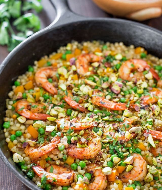 couscous with shrimp and peas in a pot