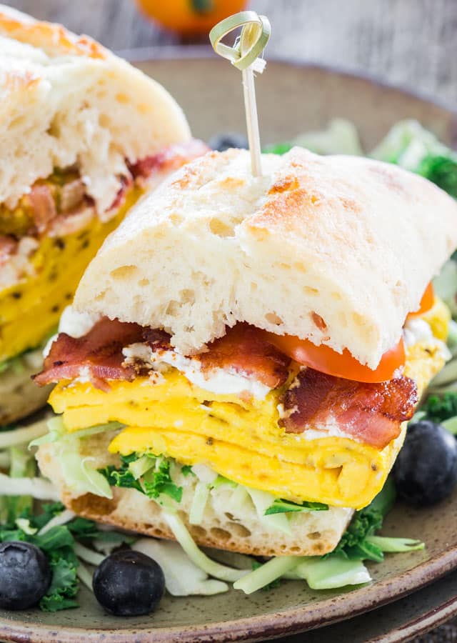 Close up shot of Bacon Omelette Goat Cheese Ciabatta Breakfast Sandwiches