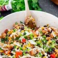 a bowl full of mexican chicken and rice salad