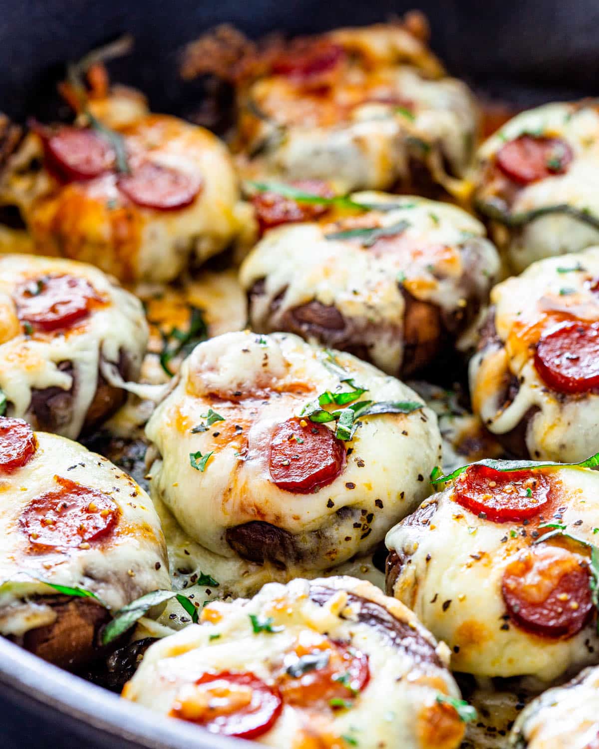 gorgeous pizza stuffed mushrooms in a skillet