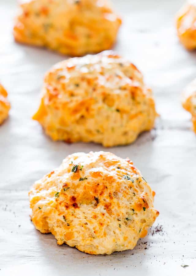 Copycat Red Lobster Cheddar Bay Biscuits on parchment paper.