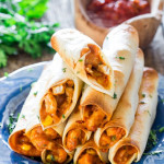 a stack of chicken taco taquitos on a plate
