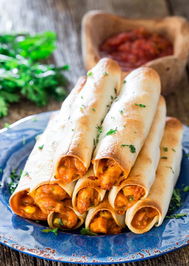 Chicken Taco Taquitos - these yummy chicken taquitos are baked but still cheesy and loaded with delicious goodness! Perfect for an appetizer, a snack or even lunch.