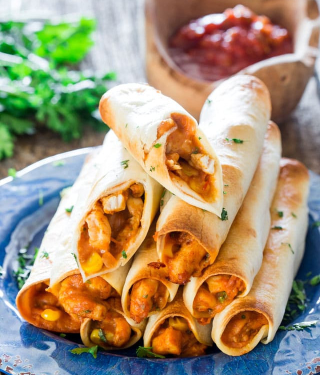 a stack of chicken taco taquitos on a plate
