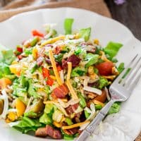 chopped salad with orzo and veggies on a plate