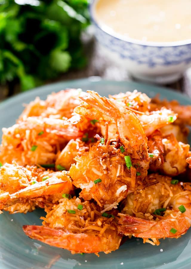 Coconut Shrimp with Spicy Mango Dipping Sauce - juicy jumbo shrimp rolled in sweetened shredded coconut, fried to a delicious crisp and served with an incredible spicy mango dipping sauce.