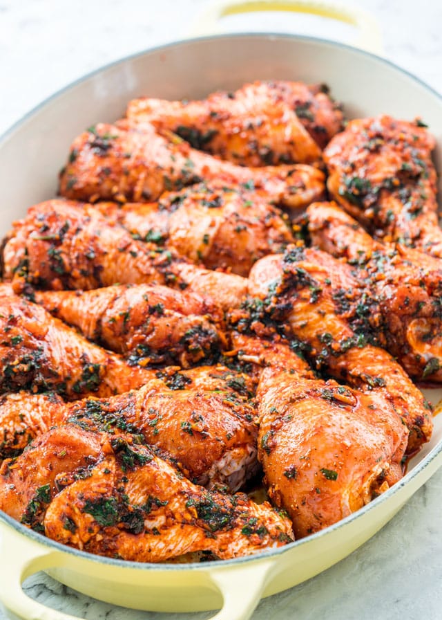Garlic and Paprika Chicken rubbed in spices in a baking dish before cooking
