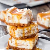 a stack of salted caramel apple pie cheesecake squares