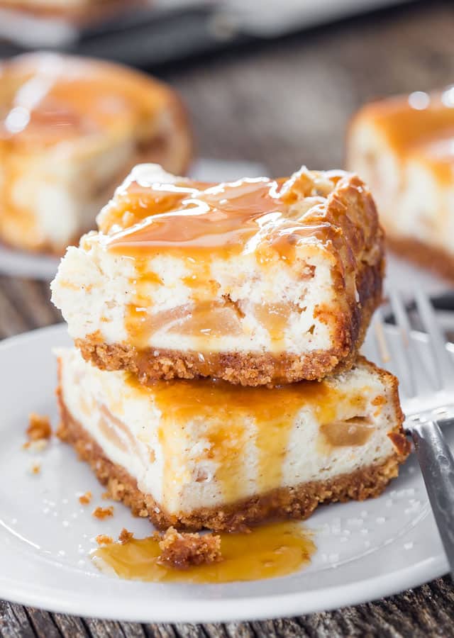 2 apple pie cheesecake bars stacked on top of each other