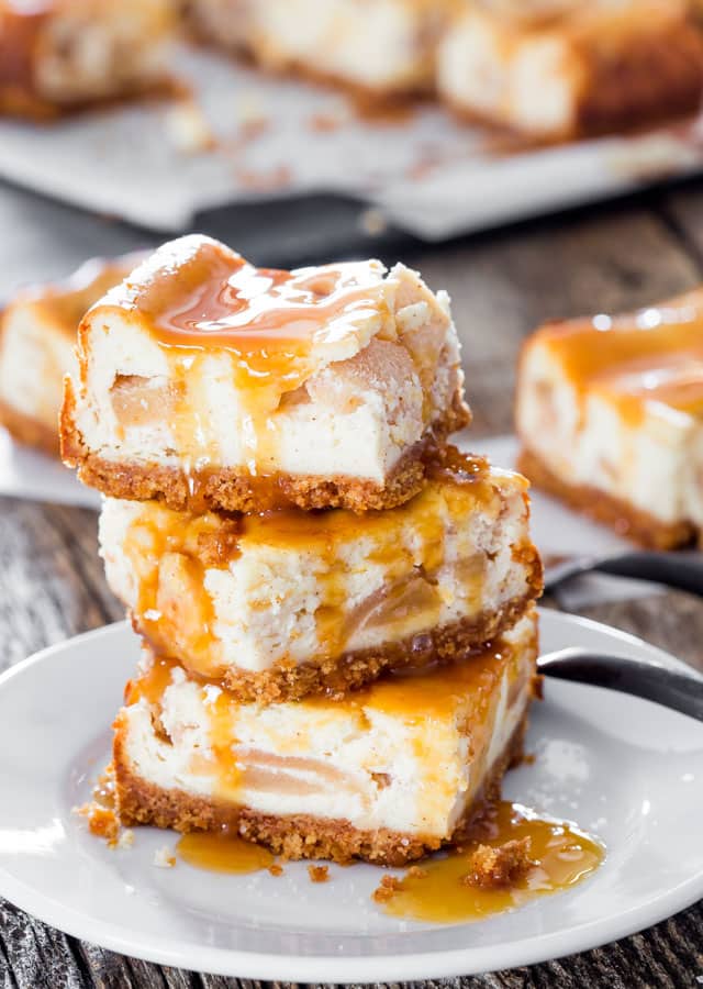 3 Salted Caramel Apple Pie Cheesecake Bars stacked on top of each other