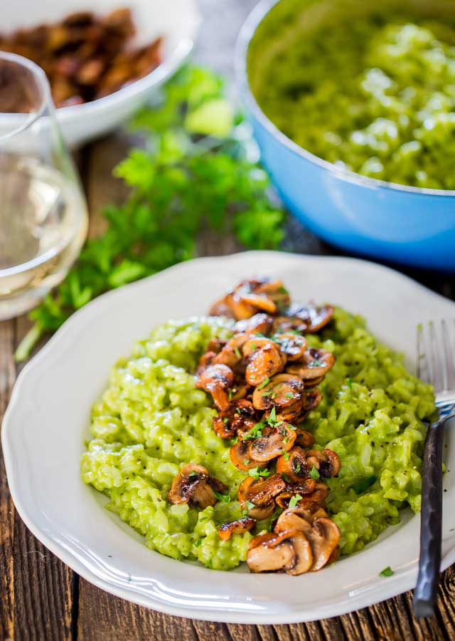 Arugula and Basil Pesto Risotto with Sauteed Mushrooms! Risotto is the epitome of Italian home cooking and comfort food. Learn to make this simple pesto risotto with sauteed mushrooms, it's sinful, decadent and very comforting!