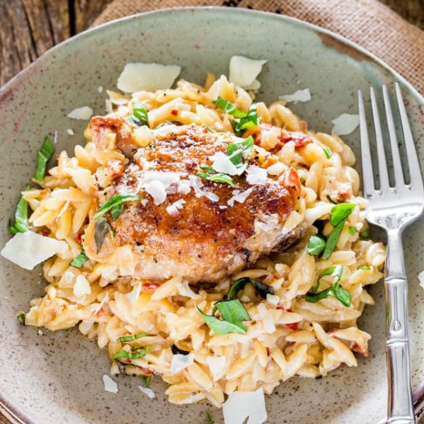 creamy chicken orzo on a plate with a fork