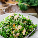 a plate of kale and quinoa salad with a fork resting on the plate