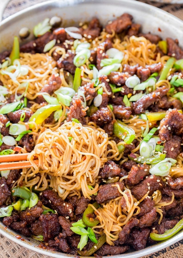 Mongolian Beef Ramen Noodles in a skillet with chopsticks