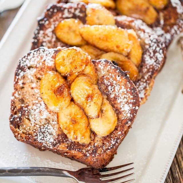 Banana Bread French Toast with Caramelized Bananas on a white plate