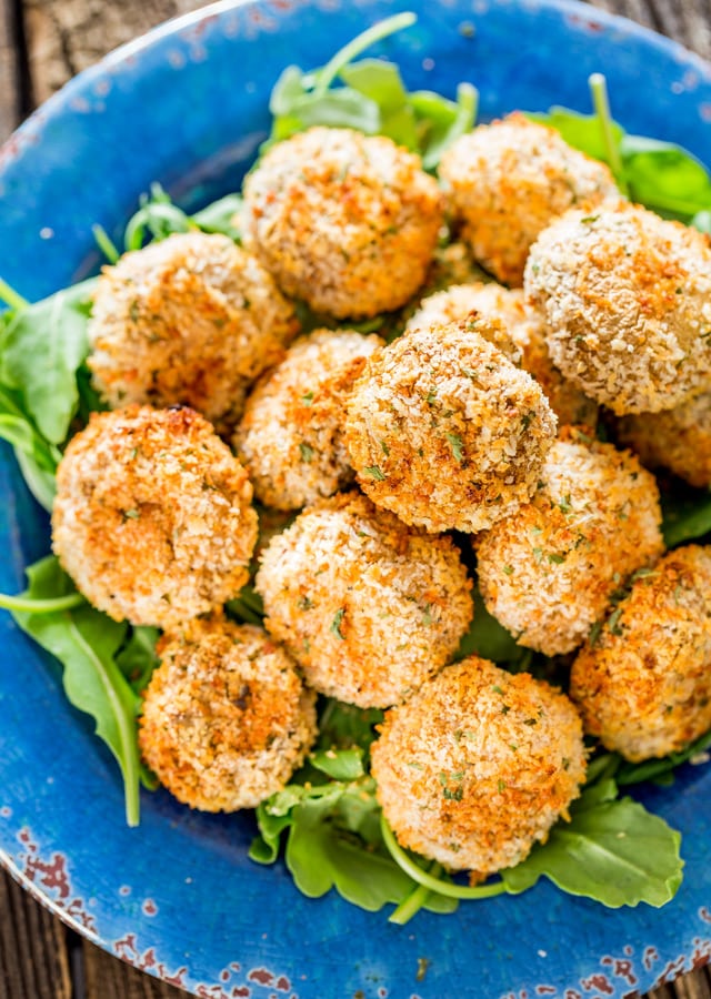 overhead of a plate stacked with Parmesan Garlic Breaded Mushrooms