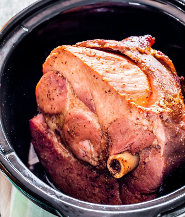 brown sugar cola glazed ham in a black crockpot
