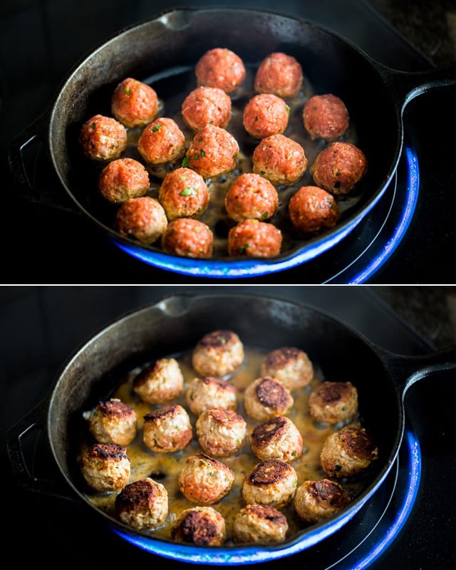Cajun Meatballs cooking in a cast iron skillet
