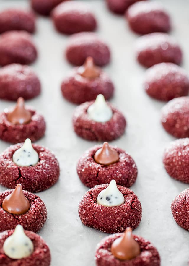Red Velvet Kiss Cookies fresh out of the oven on a baking sheet