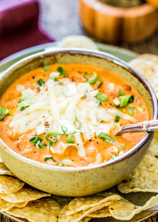 This Creamy Cheesy Chicken Enchilada Soup is a fiesta of flavors full of chunks of chicken, black beans, corn and diced tomatoes, for a complete satisfying and comforting bowl of soup.