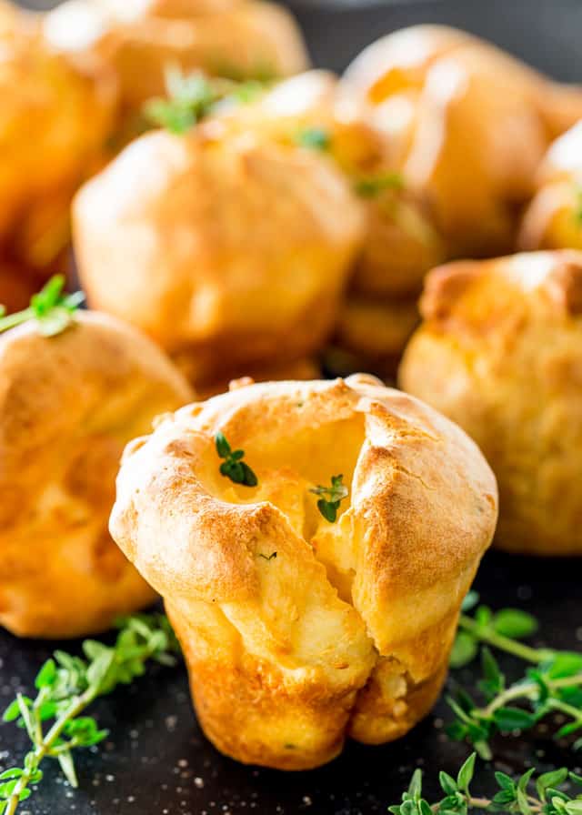 closeup of Yorkshire Puddings with sprigs of thyme