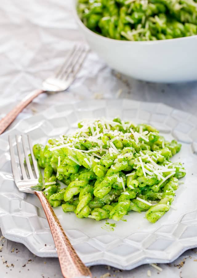 a plate of Walnut Pesto Pasta topped with parmesan