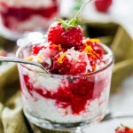 side view shot of a spoon taking a scoop of coconut rice pudding with berry sauce