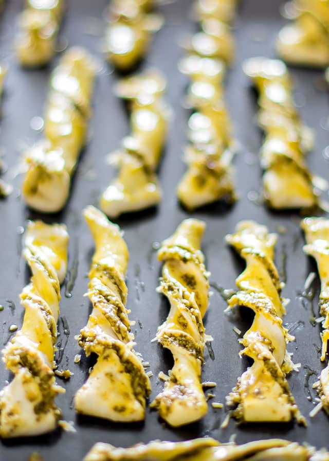 a pan of parmesan pesto twists ready to be baked in the oven