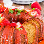side view shot of a sliced pound cake with strawberry glaze