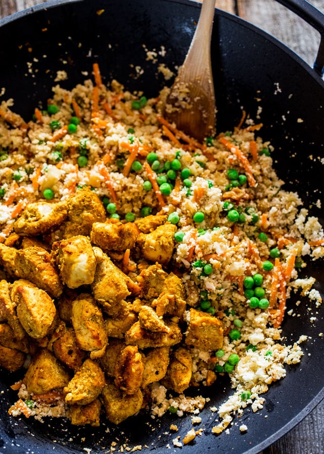 overhead of a wok filled wth Cauliflower Fried Rice with Chicken