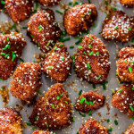close up shot of sticky honey sriracha chicken bites