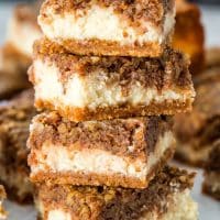 side view stack of a shot of pecan pie cheesecake bars