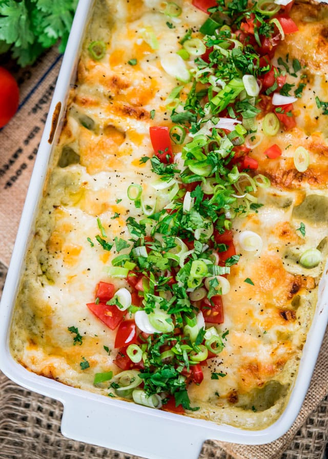Green Chile Chicken Enchilada Casserole fresh out of the oven in a casserole dish