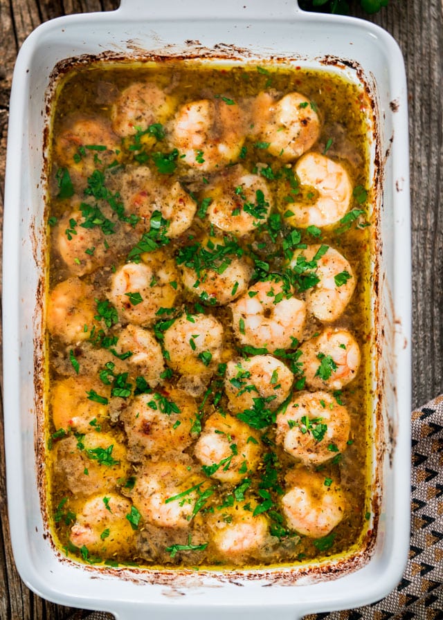 overhead of a casserole dish filled with italian shrimp bake in sauce