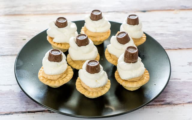 When peanut butter, cream cheese, flaky tart shells, rolos and creamy goodness coincide, you're going to end up with these indulgent peanut butter mini tarts.