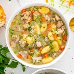 chicken gnocchi soup in a white bowl.