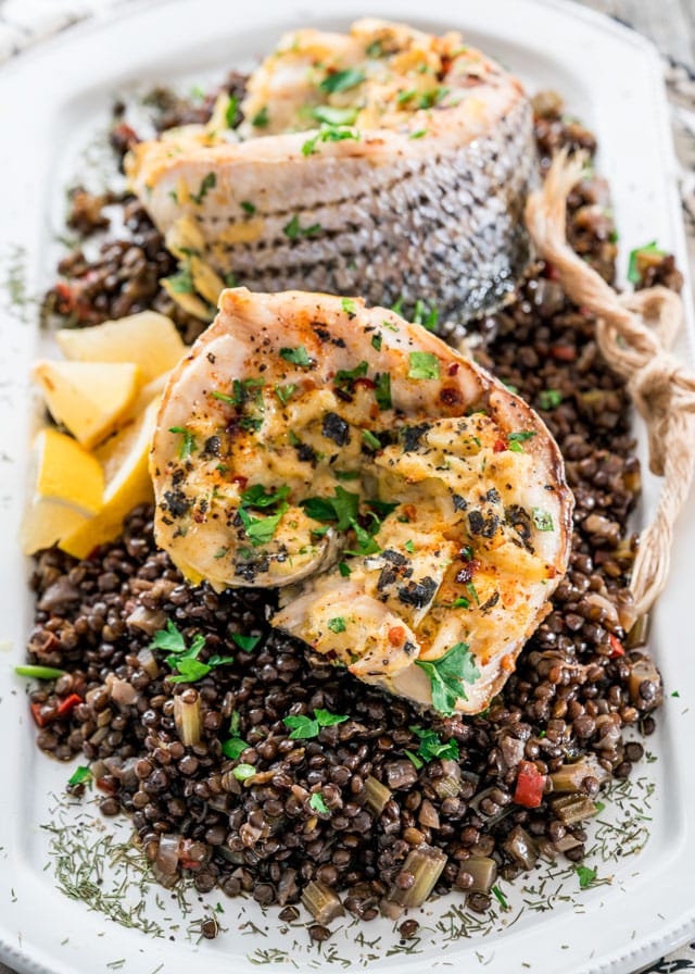 Blue Pointe Stuffed Striped Sea Bass on a bed of beluga lentils