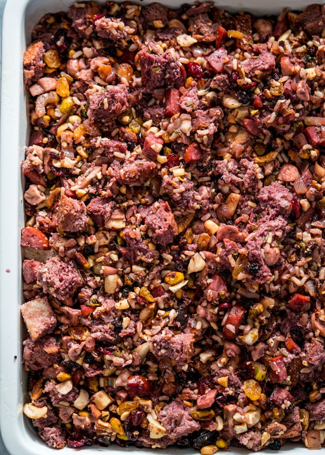 overhead of a baking dish filled with nut stuffing and dried fruits