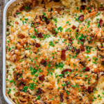 overhead shot of scalloped sweet potatoes in a baking dish