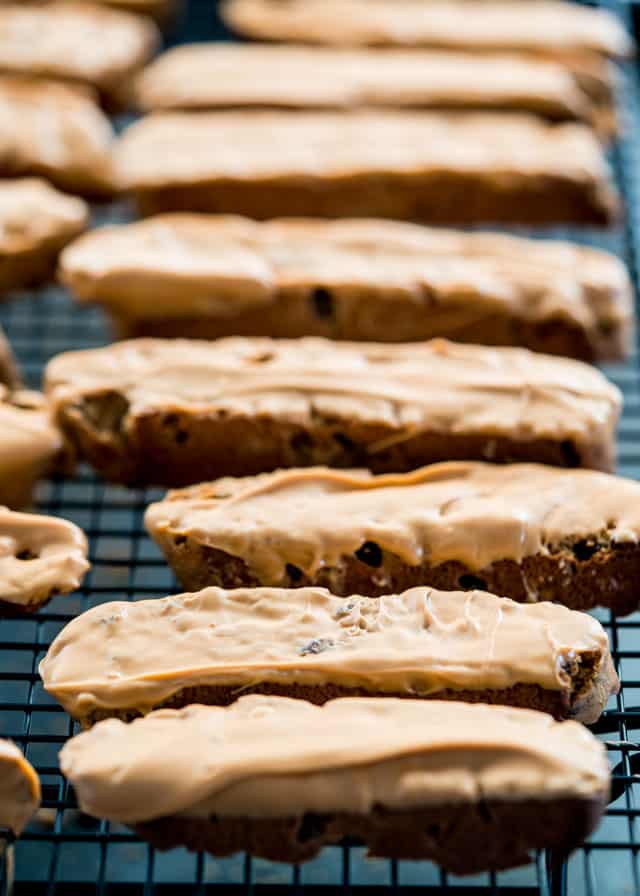 biscotti dipped in toffee on a cooling rack
