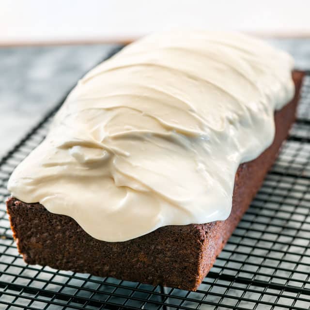 Gingerbread Loaf with cream cheese icing on cooling rack