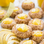side view close up shot of lemon thumbprint cookies garnished with lemon slices