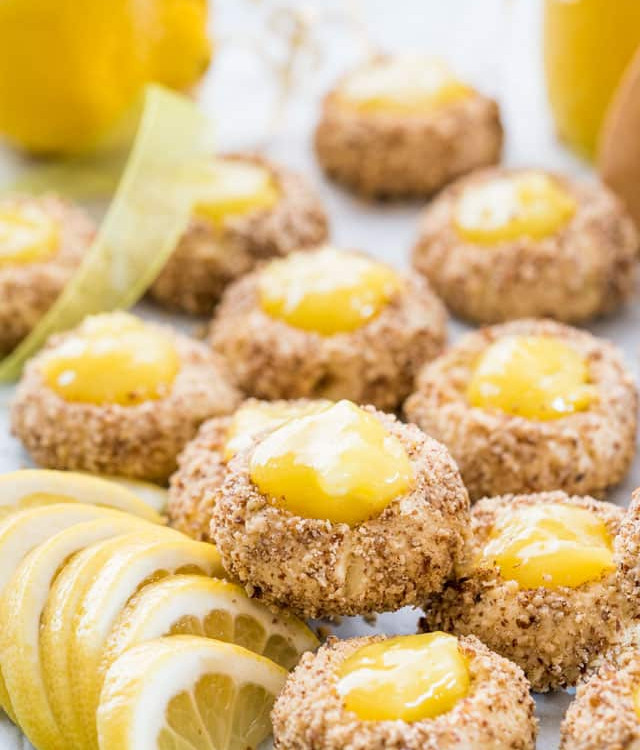 side view close up shot of lemon thumbprint cookies garnished with lemon slices