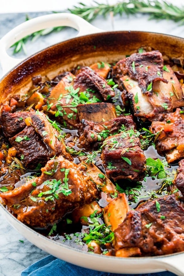 side view shot of guinness braised short ribs in a pan