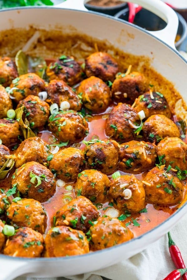 side view shot of indonesian meatballs in a pot