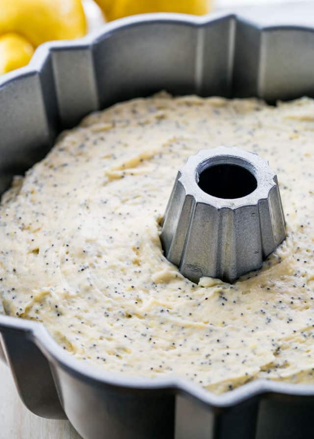 a bundt pan filled with lemon poppyseed cake batter